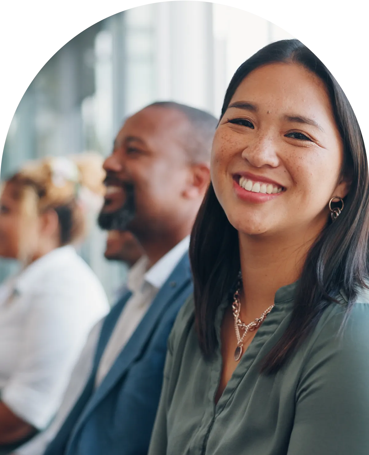 Woman smiling at camera in a meeting